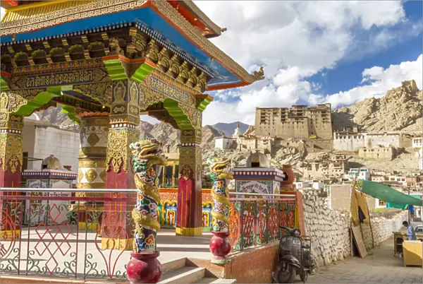 Prayer wheel & Leh Palace in background, Leh, Ladakh, India