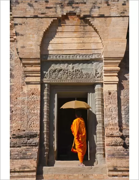 Monk in Prasat Kravan with brick structure, Angkor Wat, UNESCO World Heritage site