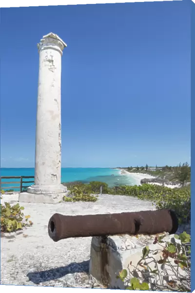 Bahamas, Little Exuma Island. Rusty cannon and column marking salt ponds location
