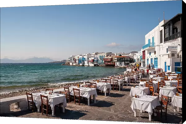 Restaurant tables on the seaside in the Little Venice neighborhood. Chora, Mykonos Island, Cyclades Islands, Greece