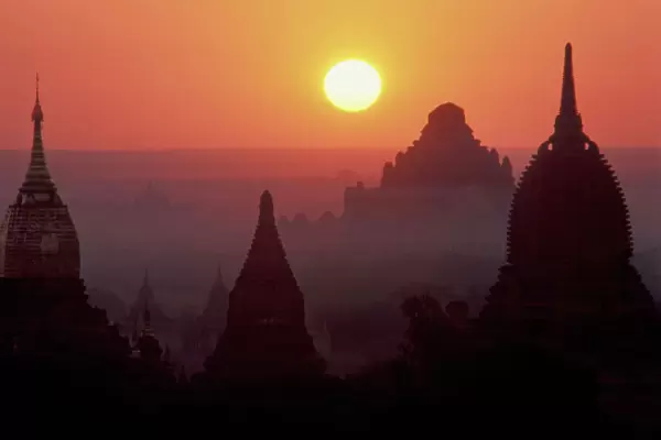Asia, Burma, (Myanmar), Pagan (Bagan) The temple complex of Pagan at dawn. Gilded