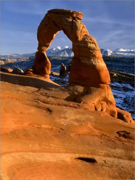 ARCHES NATIONAL PARK, UTAH. USA. Delicate Arch. La Sal Mountains in distance