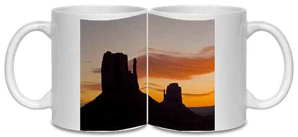 The west and east Mitten buttes silhouetted at sunset, Monument Valley, Navajo Tribal Park, Arizona