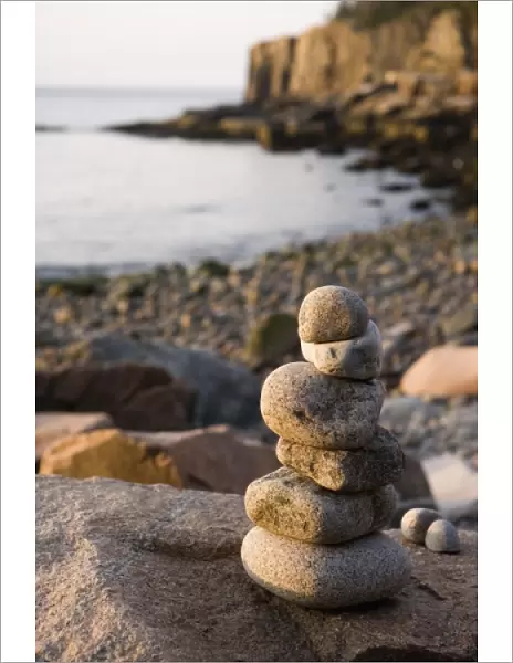 A rock cairn on the cobblestone beach in Momument Cove in Maines Acadia National Park
