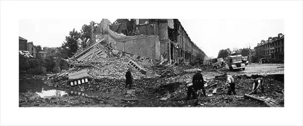 Bomb damage and crater, Petherton Road, London, WW2