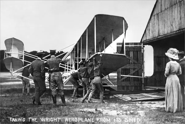 Taking the Wright Aeroplane from its Shed. Photograph, c1908