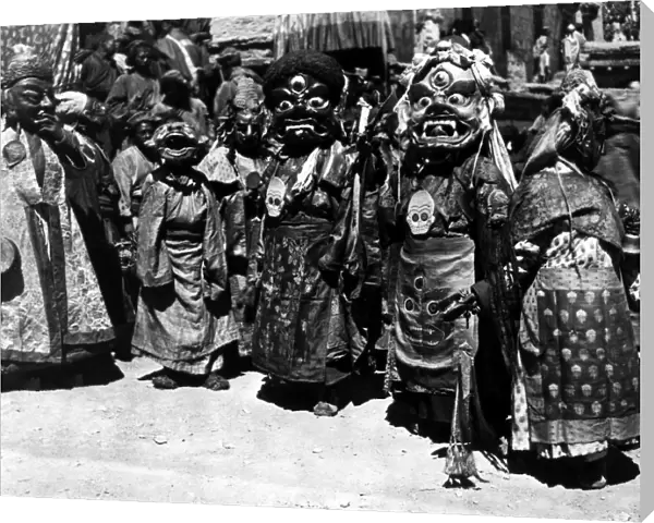 Tibetan monks wearing masks, each symbolizing a mental defilement. Film still, mid-20th century