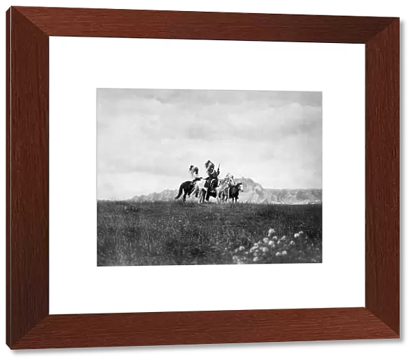 SIOUX HORSEMEN, c1905. A group of three Sioux Native American men on horseback