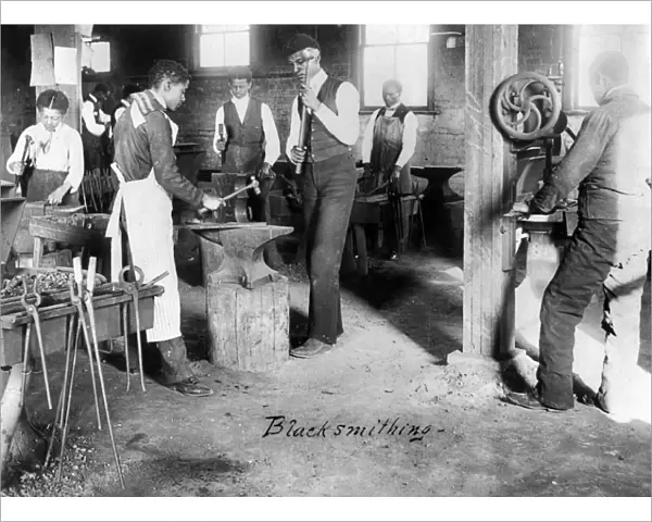 BLACKSMITH CLASS, c1899. African American students learning blacksmithing at the Agricultural