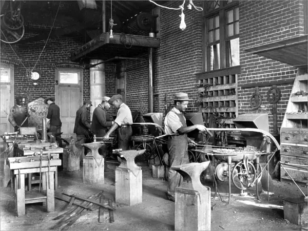 VIRGINIA: BLACKSMITH. Young men training in blacksmithing at Hampton Institute, Hampton, Virginia
