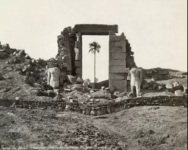 EGYPT: TEMPLE OF AMENOPHIS. Ruins of the temple of Amenophis, flanked by statues of Ramesses IV