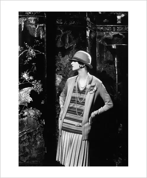 WOMENs FASHION, 1926. A model wearing an outfit designed by Gabrielle Coco Chanel in 1926