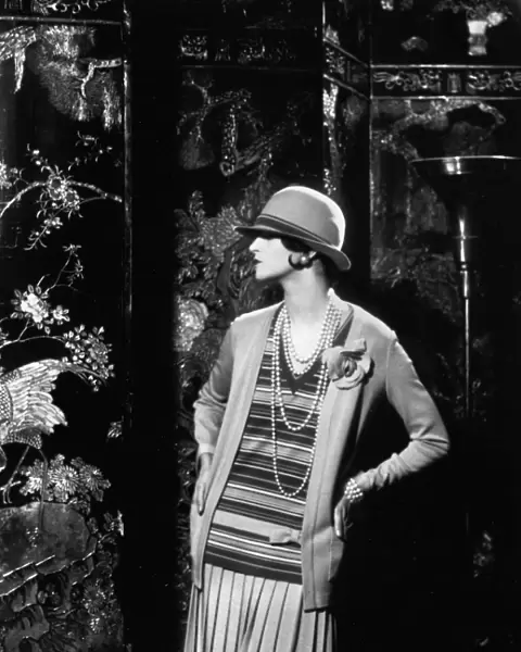 WOMENs FASHION, 1926. A model wearing an outfit designed by Gabrielle Coco Chanel in 1926
