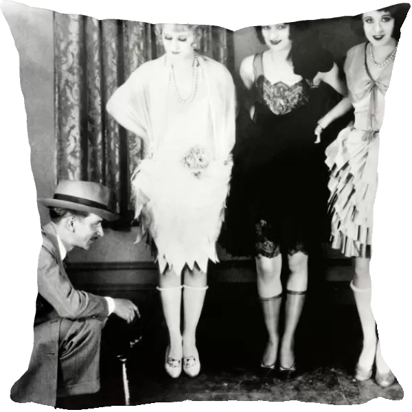 WOMENs FASHION: 1920S. These three flappers of the 20s stylishly expose their