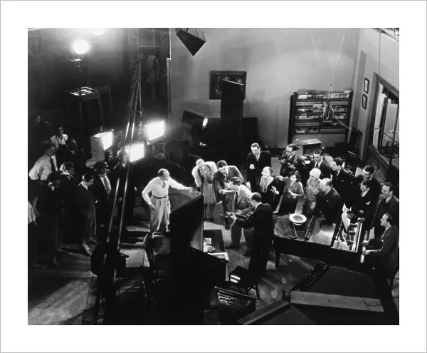 BROADWAY MELODY, 1929. Actors and film crew on the set of Broadway Melody. Photograph