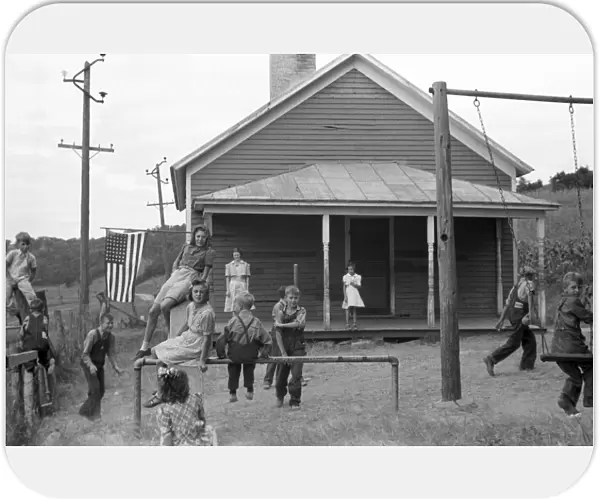 RURAL SCHOOLYARD, 1939. Children playing in the schoolyard of a rural one-room