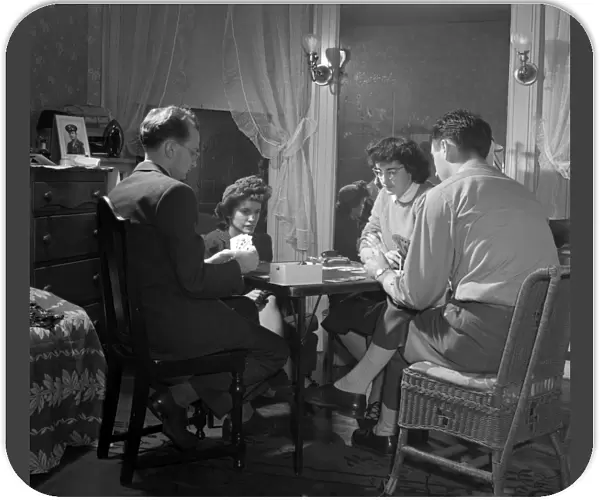 CARD GAME, 1943. Residents playing bridge at their boarding house in Washington, D