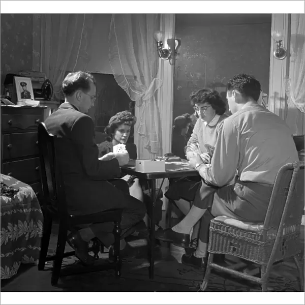 CARD GAME, 1943. Residents playing bridge at their boarding house in Washington, D