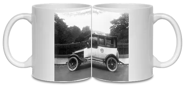 WASHINGTON, DC: TAXI, c1921. A black and white taxi cab outside the White House in Washington, D
