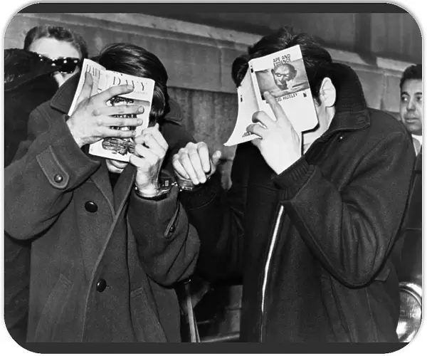 NEW YORK: ARREST, 1968. Two college students covering their faces at the police station