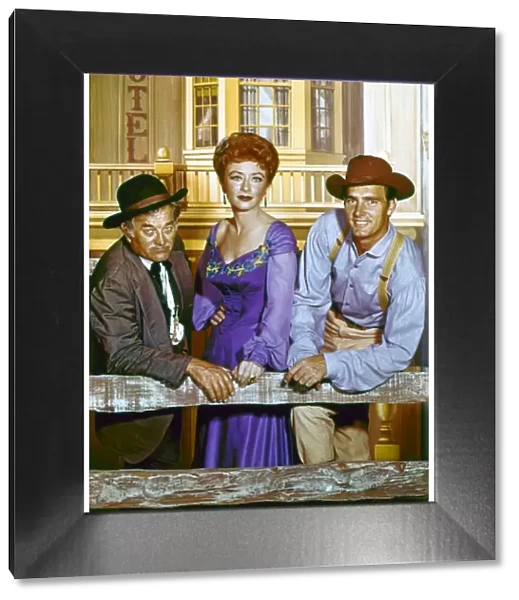 GUNSMOKE, c1960. Cast members Milburn Stone, Amanda Blake, and Dennis Weaver in a publicity photograph for the television series Gunsmoke, c1960