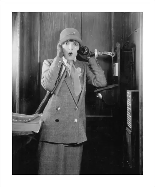 TELEPHONE BOOTH, 1920s. Colleen Moore in a 1920s silent movie still