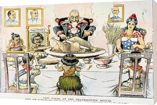 THANKSGIVING CARTOON, 1898. New Faces at the Thanksgiving Dinner: American cartoon, 1898, on the U. S. territorial acquisitions following the conclusion of the Spanish-American War