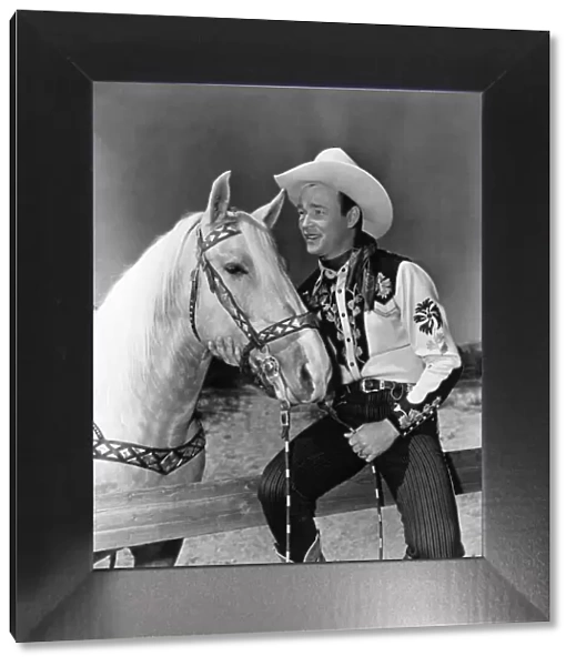 ROY ROGERS (1912-1998). Leonard Slye. American singing cowboy actor. Photographed with his horse Trigger