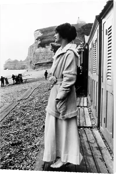 GABRIELLE COCO CHANEL (1883-1971). French fashion designer. Photographed on the beach in Etretat, Normandy, early 20th century. In the background is the cliff, Falaise d Amont