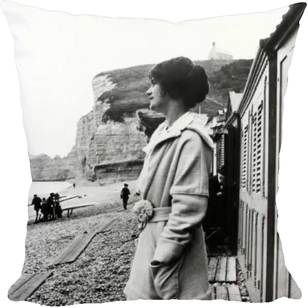 GABRIELLE COCO CHANEL (1883-1971). French fashion designer. Photographed on the beach in Etretat, Normandy, early 20th century. In the background is the cliff, Falaise d Amont