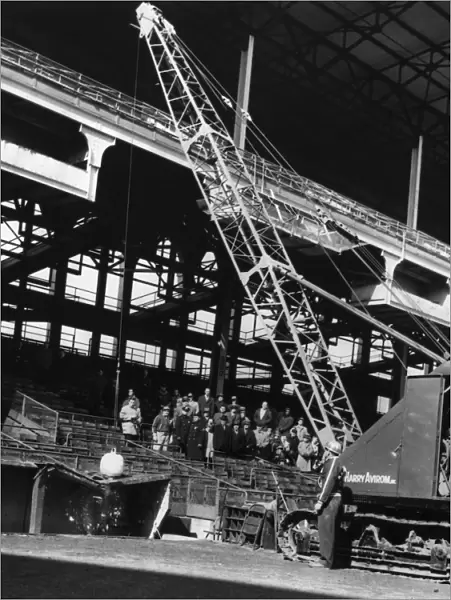 BROOKLYN: EBBETS FIELD. A crane with a wrecking ball on top of the visitors dugout at Ebbets Field in Brooklyn, New York, 23 February 1960, at the start of the demolition of the stadium that had been the home of the Brooklyn Dodgers prior to their moving to Los Angeles two years earlier