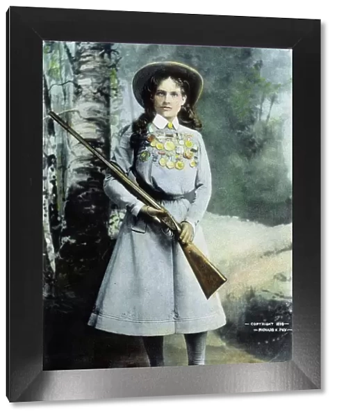 ANNIE OAKLEY (1860-1926). Oil over a photograph, 1899