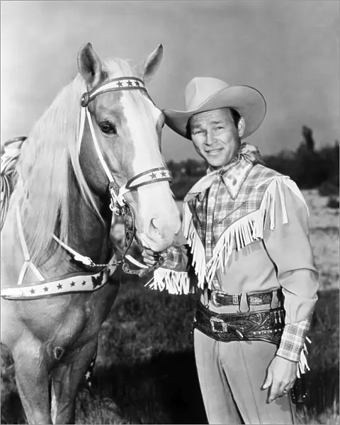 ROY ROGERS (1912-1998). Leonard Slye. American singing cowboy actor. With his horse, Trigger