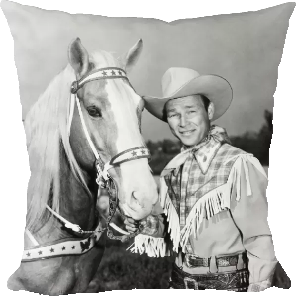 ROY ROGERS (1912-1998). Leonard Slye. American singing cowboy actor. With his horse, Trigger