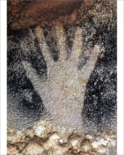 CAVE ART: PECH MERLE. Prehistoric human handprint from Pech Merle cave, France