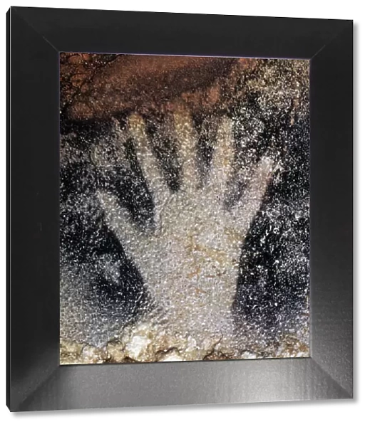CAVE ART: PECH MERLE. Prehistoric human handprint from Pech Merle cave, France