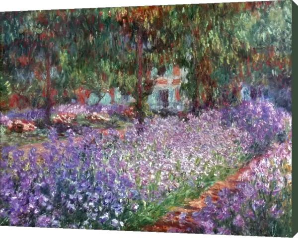 MONET: GIVERNY, 1900. The Artists Garden at Giverny. Oil on canvas by Claude Monet, 1900