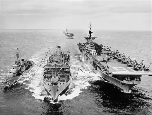 KOREAN WAR: SHIP REFUELING. The destroyer USS Shelton and the aircraft carrier USS Antietam refueling from the tanker USS Tolovana in Korean waters. The aircraft carrier USS Essex, in the the background, awaits her turn. Photograph, 1953