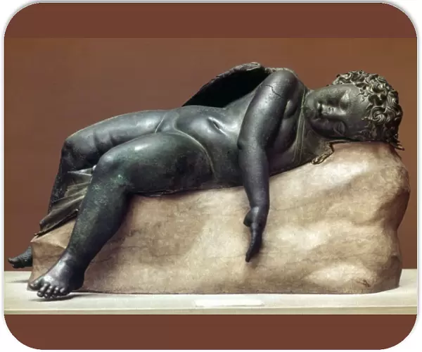 MYTHOLOGY: SLEEPING EROS. Hellenistic bronze from Greece, 250-150 B. C