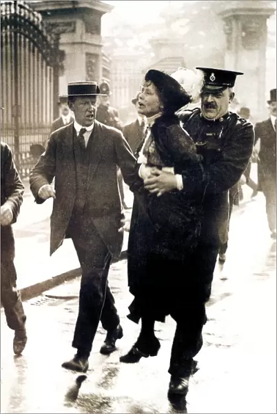 EMMELINE PANKHURST (1858-1928). English woman-suffrage advocate. Mrs. Pankhurst arrested outside Buckingham Palace, London, while trying to present a petition to King George V, 21 May 1914