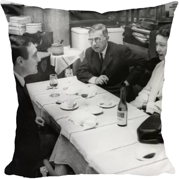 SARTRE & BEAUVOIR, 1964. French philosopher Jean-Paul Sartre and writer Simone Beauvoir having lunch at a cafe in Paris, 1964