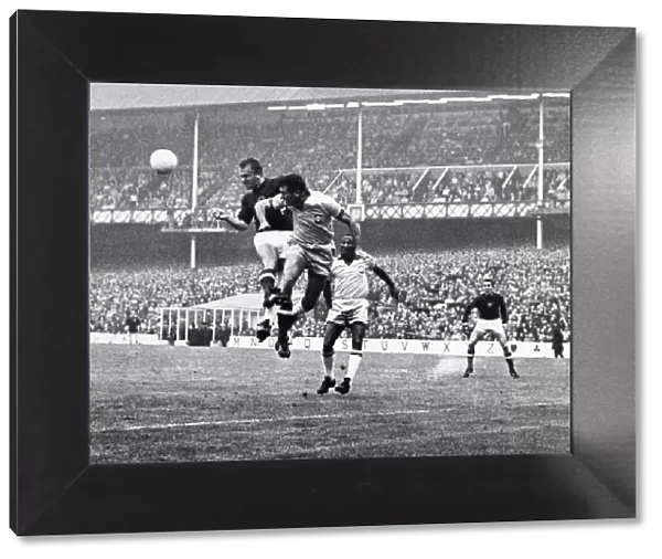 WORLD CUP, 1966. Kalman Meszoly of Hungary and Hilderaldo Bellini of Brazil head the ball during the 1966 World Cup, held in England. Photograph 15 July 1966