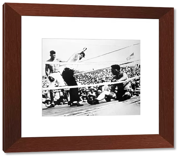 American boxer. Jack Dempsey (left) winning the heavyweight championship from Jess Willard on 4 July 1919 at Toledo, Ohio