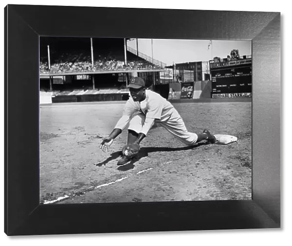 JACKIE ROBINSON (1919-1972). John Roosevelt Robinson, known as Jackie. American baseball player. Playing first base for the Brooklyn Dodgers at Ebbets Field, Brooklyn, probably 1947