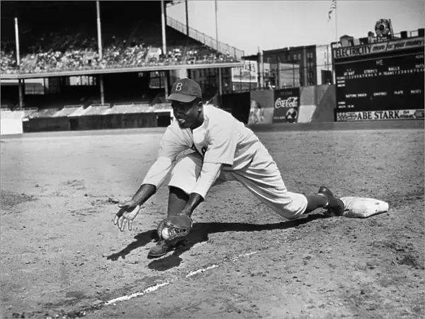 JACKIE ROBINSON (1919-1972). John Roosevelt Robinson, known as Jackie. American baseball player. Playing first base for the Brooklyn Dodgers at Ebbets Field, Brooklyn, probably 1947