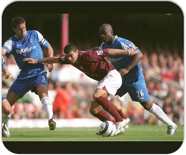 Jose Reyes (Arsenal) under pressure from Matthew Upson and Olivier Tibily (Birmingham)