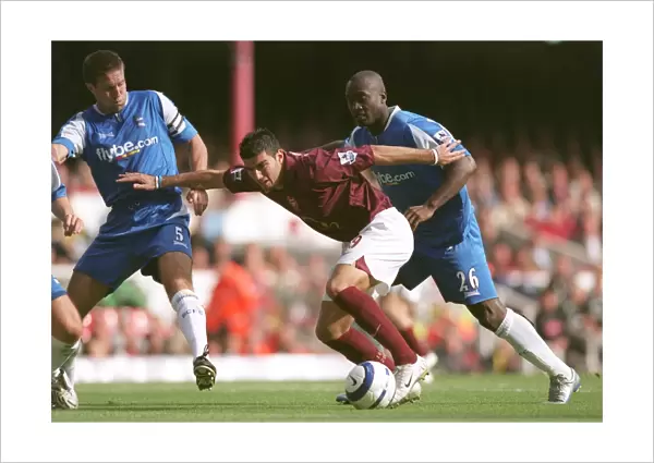 Jose Reyes (Arsenal) under pressure from Matthew Upson and Olivier Tibily (Birmingham)