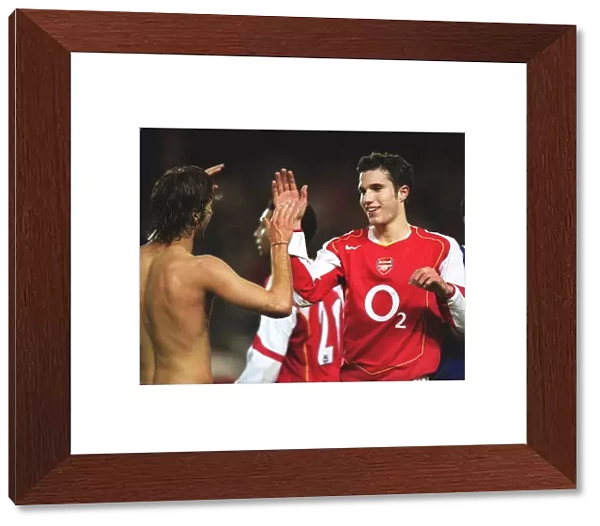 Robin van Persie and Mathieu Flamini celebrate Arsenals win at the end of the match