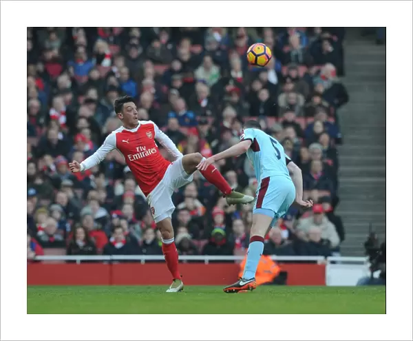Arsenal's Ozil Outmaneuvers Burnley's Keane in Premier League Clash