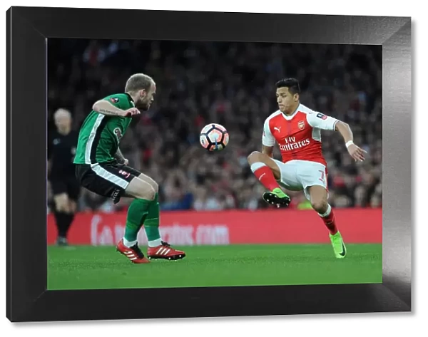 Arsenal's Alexis Sanchez Clashes with Lincoln City's Bradley Wood in FA Cup Quarter-Final